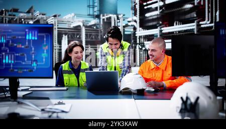 Oil And Gas Automation. Diverse Workers Using Control Computers Stock Photo