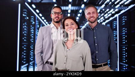 Happy Data Center Engineer Team In Server Room Stock Photo