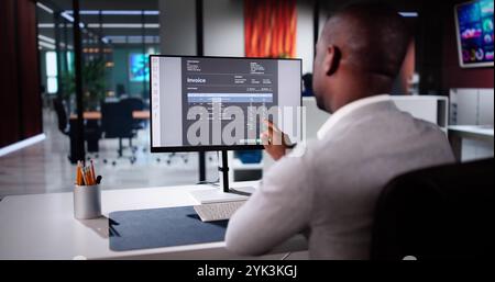 E Invoice Business Management. Accountant Using Electronic Invoice Stock Photo