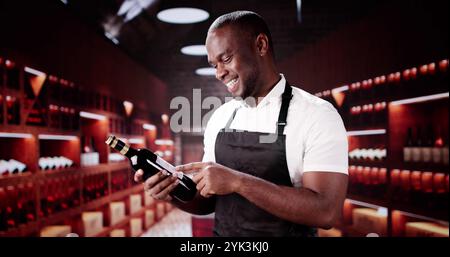 Wine Service Waiter Holding A Bottle In Basement Stock Photo