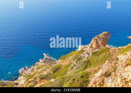 View of Folegandros Island multicolored rocks coastline, Chora, Folegandros Island, Cyclades Islands, Greece Stock Photo