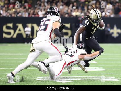 New Orleans, United States. 10th Nov, 2024. Atlanta Falcons linebacker Nate Landman (53) tries to tackle New Orleans Saints running back Alvin Kamara (41) during a National Football League contest at the Caesars Superdome on Sunday, November 10, 2024 in New Orleans, Louisiana. (Photo by Peter G. Forest/Sipa USA) Credit: Sipa USA/Alamy Live News Stock Photo