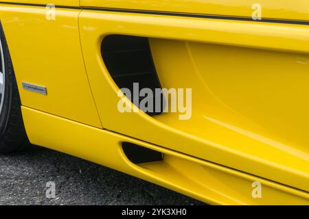 Close up detail of the side air intakes of a giallo modena yellow Ferrari F355 Berlinetta Italian sports car produced from 1994 to 1999. Stock Photo
