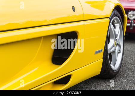 Close up detail of the side air intakes of a giallo modena yellow Ferrari F355 Berlinetta Italian sports car produced from 1994 to 1999. Stock Photo