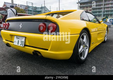 Close up detail of the rear of a giallo modena yellow Ferrari F355 Berlinetta Italian sports car produced from 1994 to 1999. Stock Photo