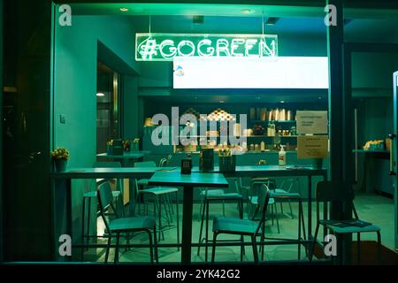 Milan, Italy - October 10, 2021: Neon sign go green in a cafe in Milan, Italy Stock Photo