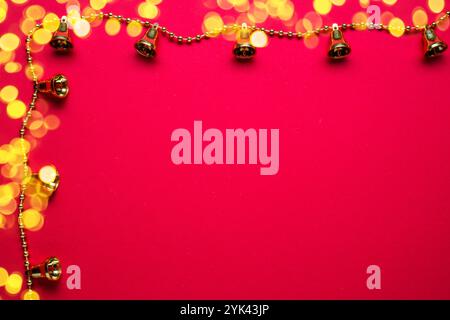 Blurred christmas lights as a frame on red festive christmas background. Stock Photo