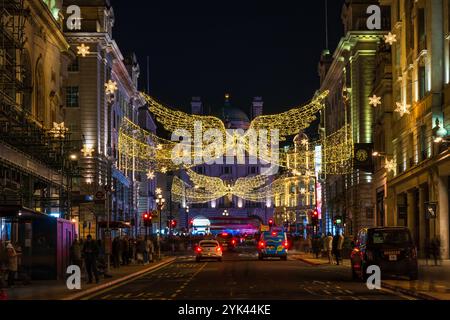 LONDON - NOVEMBER 15, 2024: Christmas lights on Regents Street St James. Beautiful Christmas decorations attract thousands of shoppers during the fest Stock Photo