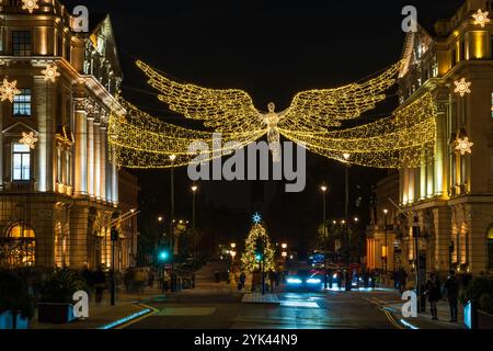 LONDON - NOVEMBER 15, 2024: Christmas lights on Regents Street St James. Beautiful Christmas decorations attract thousands of shoppers during the fest Stock Photo