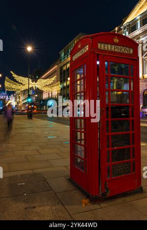 LONDON - NOVEMBER 15, 2024: Christmas lights on Regents Street St James. Beautiful Christmas decorations attract thousands of shoppers during the fest Stock Photo