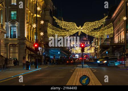 LONDON - NOVEMBER 15, 2024: Christmas lights on Regents Street St James. Beautiful Christmas decorations attract thousands of shoppers during the fest Stock Photo