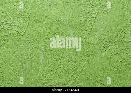 Green Decorative Paint for Walls. Rough Stylized Texture Banner With Space For Text. Sustainability Concept Stock Photo