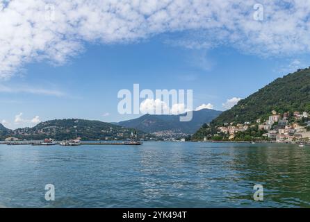 A picture of the edge of Lake Como as seen from the city of Como. Also visible is the Life Electric sculpture, created by Daniel Libeskind, in 2015, a Stock Photo