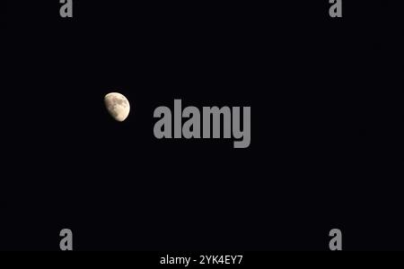 half moon floating on sky in night Stock Photo