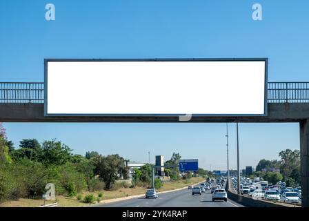 Blank empty billboard mockup template for advertising over a highway in South Africa. Blue sky Stock Photo