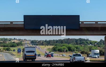 Blank empty billboard mockup template for advertising over a highway in South Africa. Blue sky Stock Photo