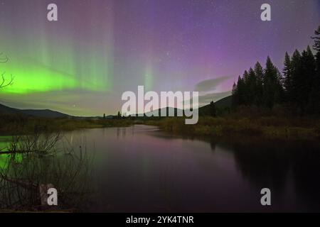 Northern Lights over the Yaak River on May 11, 2024. Yaak Valley, northwest Montana. Stock Photo