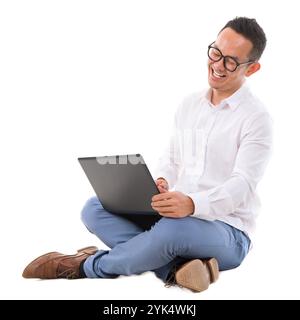 Excited Asian male using laptop Full length of excited Asian businessman looking at laptop sitting over white background Copyright: xZoonar.com/szefei Stock Photo