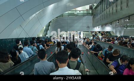 Hong Kong 2024 May 2: crowded of people inside the station of MTR. MTR is the main and only one subway transport in Hong Kong Stock Photo