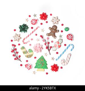 Christmas objects laid out in the shape of a Christmas bauble isolated on white background, top view. Christmas, winter holiday, new year concept. Stock Photo