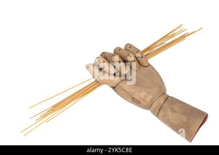 whole wheat spaghetti in a wooden hand on a transparent background Stock Photo