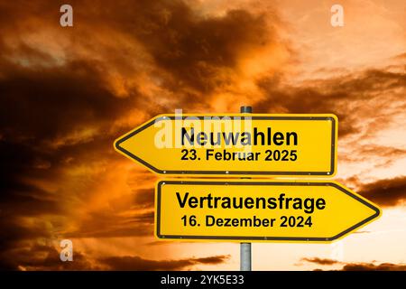 Neuwahlen nach der Vertrauensfrage Zwei Wegweiser zeigen in gegensätzlicher Richtung und sind beschriftet mit Neuwahlen am 23. Februar 2025 und Vertra Stock Photo