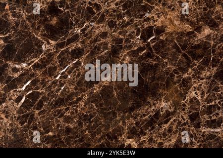 Natural brown marble surface with organic patterns, perfect for home decor. Stock Photo