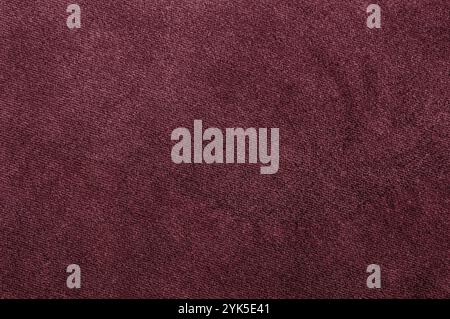 High-quality burgundy velour texture, revealing fine details of a plush and elegant fabric. Stock Photo