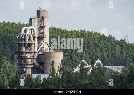 Opencast mining quarry with machinery and mining equipment. Limestone mining for cement production Stock Photo