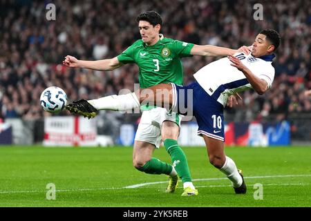 Republic of Ireland's Callum O'Dowda (left) and England's Jude Bellingham battle for the ball during the UEFA Nations League Group B2 match at Wembley Stadium, London. Picture date: Sunday November 17, 2024. Stock Photo