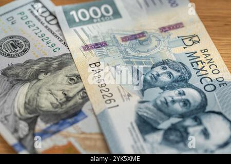 Mexico money , Exchange rate, peso vs dollar. Financial concept. 1000 Mexican pesos and 100 US dollars. Close up Stock Photo