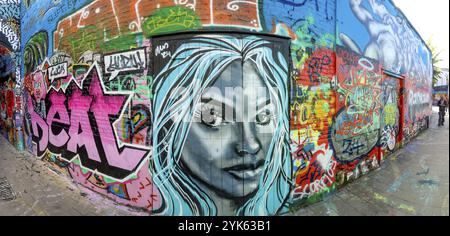 Street art, graffiti of a portrait of a woman by alleyway artists in the graffiti alley in Werregarenstraat, Ghent, East Flanders, Belgium, Europe Stock Photo