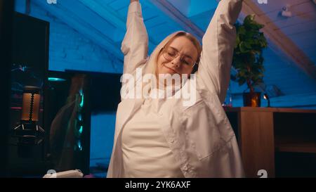 Late night online work deadline tired female girl business woman businesswoman worker coder hacker developer typing computer crypto trading web e Stock Photo