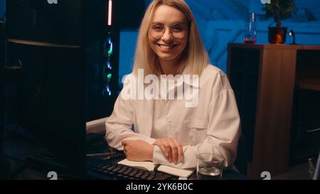 Caucasian woman female broker trader businesswoman business commerce trading crypto currency night late time working computer at home typing Stock Photo