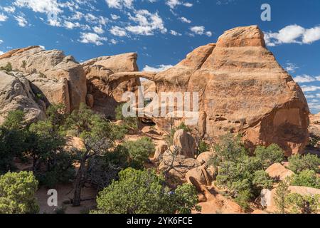 Panoramic view along the Devils Garden Trail with Double O Arch in Arches National Park in Utah Stock Photo