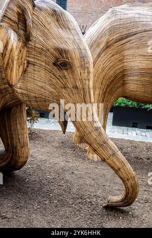 Great Elephant Migration sculpture by the Coexistence Collective, constructed by Indian indigenous artisans out of the Lantana camara, New York City Stock Photo