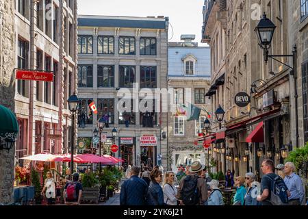 Montreal, QC, Canada-September 30, 2024: Busy city street with tourists in Old Montreal neighborhood. Stock Photo