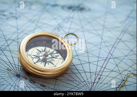 Old compass on vintage map Stock Photo