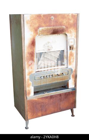 Old rusty candy vending machine with coin slots to choose which candy you prefer. Machine has legs, slots, windows. Antique display for candy snacks. Stock Photo