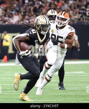 New Orleans, United States. 17th Nov, 2024. New Orleans Saints running back Alvin Kamara (41) runs past Cleveland Browns defensive end Myles Garrett (95) during a National Football League contest at the Caesars Superdome on Sunday, November 17, 2024 in New Orleans, Louisiana. (Photo by Peter G. Forest/Sipa USA) Credit: Sipa USA/Alamy Live News Stock Photo