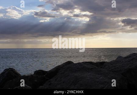 Rocks and Ocean at St Pete Beach FL Late Afternoon Stock Photo