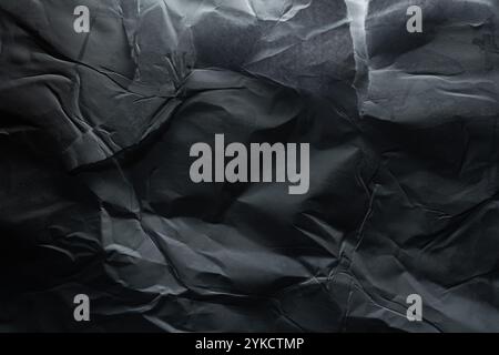 Crumpled and torn black paper texture Stock Photo