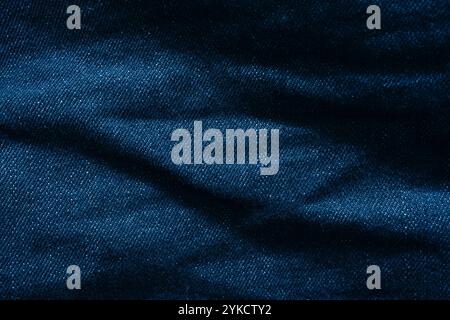 Crumpled jeans fabric texture background Stock Photo