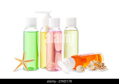 Assorted skincare products displayed on a white surface with a seashell Stock Photo