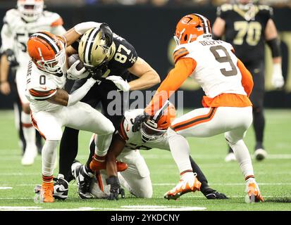 New Orleans, United States. 17th Nov, 2024. Cleveland Browns cornerback Greg Newsome II (0) tackles New Orleans Saints tight end Foster Moreau (87) during a National Football League contest at the Caesars Superdome on Sunday, November 17, 2024 in New Orleans, Louisiana. (Photo by Peter G. Forest/Sipa USA) Credit: Sipa USA/Alamy Live News Stock Photo