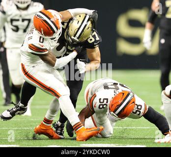 New Orleans, United States. 17th Nov, 2024. Cleveland Browns cornerback Greg Newsome II (0) tackles New Orleans Saints tight end Foster Moreau (87) during a National Football League contest at the Caesars Superdome on Sunday, November 17, 2024 in New Orleans, Louisiana. (Photo by Peter G. Forest/Sipa USA) Credit: Sipa USA/Alamy Live News Stock Photo