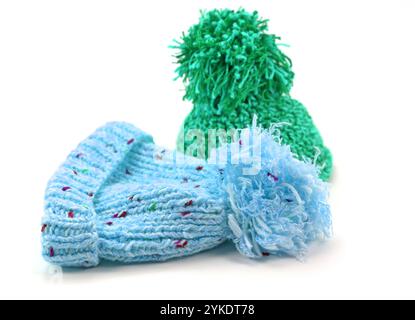 Two bobble hats against a white background Stock Photo