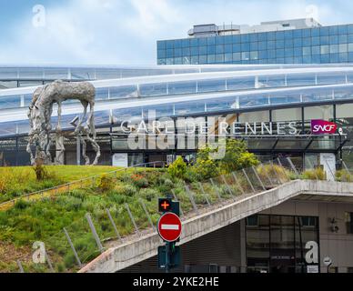 Rennes, France - July 26, 2024: Modern train station of Rennes with glass facade and metal sculpture Stock Photo