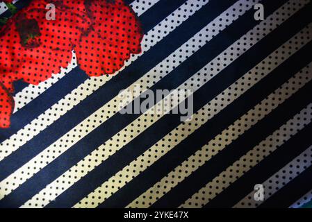 Things, objects, backgrounds made of dense synthetic fabrics of gray color with white and blue stripes, white and blue polka dots. Stock Photo