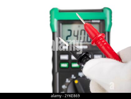Digital Multimeter Probes in Gloved Hand Stock Photo